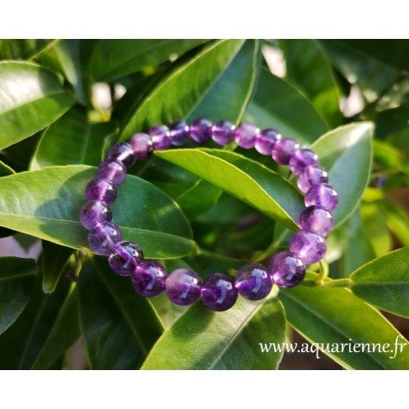 Bracelet Améthyste perles boules 8mm, qualité extra. Pierre de sagesse, favorise le calme et l'élévation spirituelle.