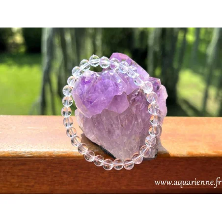 Bracelet en Cristal de roche qualité AA – perles lumineuses et polies 6mm. Lumière, pureté, harmonie.